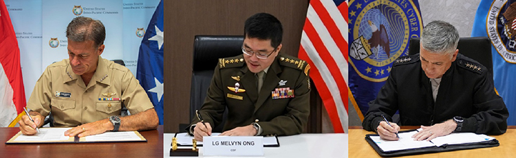 Singapore and US representatives signing an MOU on cyberspace cooperation (MINDEF)