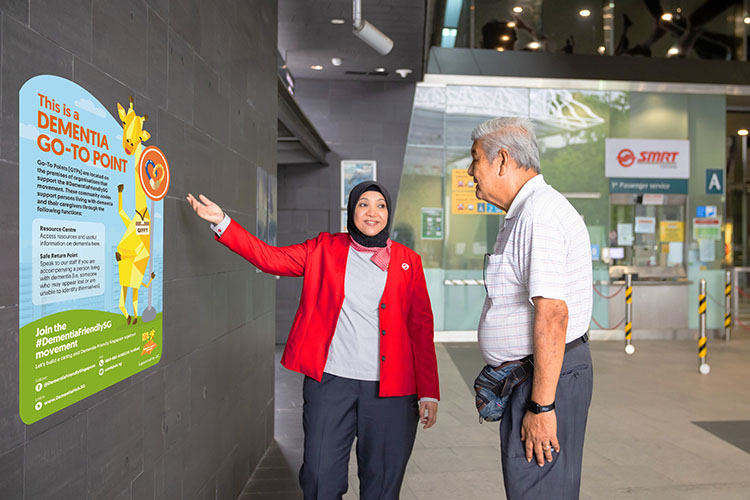 Ms Suraini introducing a Dementia Go-To Point at Stadium MRT station (SMRT)